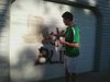 Man cleaning off a garage in southwest Fargo that was hit by vandals.