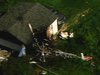 Helicopter crashes into Maplewood, Mn garage.

(Photo:  WCCO)