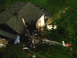 Helicopter crashes into Maplewood, Mn garage.

(Photo:  WCCO)