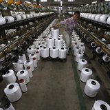 An employee works inside a textile factory in Linhai, Zhejiang province, May 30, 2013. REUTERS/William Hong An employee works inside a textile factory in Linhai, Zhejiang province, May 30, 2013. REUTERS/William Hong