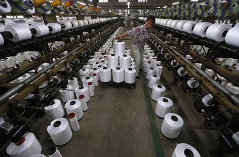 An employee works inside a textile factory in Linhai, Zhejiang province, May 30, 2013. REUTERS/William Hong An employee works inside a textile factory in Linhai, Zhejiang province, May 30, 2013. REUTERS/William Hong