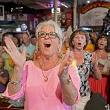 Food Network television personality Paula Deen cheers for her husband Michael Groover during the semi-finals of the "Papa" Hemingway Look-Al Food Network television personality Paula Deen cheers for her husband Michael Groover during the semi-finals of the "Papa" Hemingway Look-Al
