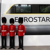 Four members of the Scot's Guards pose for a photograph next to a new Eurostar train, during a media event, in central London, October 7, 20