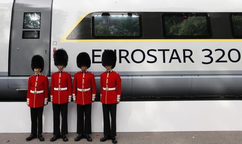 Four members of the Scot's Guards pose for a photograph next to a new Eurostar train, during a media event, in central London, October 7, 20 Four members of the Scot's Guards pose for a photograph next to a new Eurostar train, during a media event, in central London, October 7, 20
