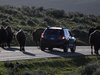 A car is stopped by a herd of bison crossing the highway in Yellowstone National Park, Wyoming, June 8, 2013. REUTERS/Jim Urquhart