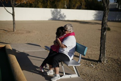 A child and a senior citizen embrace in Sun City, Arizona, January 2013. REUTERS/Lucy Nicholson A child and a senior citizen embrace in Sun City, Arizona, January 2013. REUTERS/Lucy Nicholson