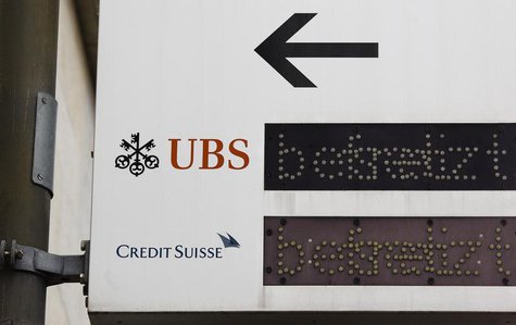 The logos of Swiss banks UBS and Credit Suisse are seen on a sign in Zurich, February 13, 2013. REUTERS/Michael Buholzer The logos of Swiss banks UBS and Credit Suisse are seen on a sign in Zurich, February 13, 2013. REUTERS/Michael Buholzer