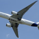 The new Airbus A350 flies over Toulouse-Blagnac airport during its maiden flight in southwestern France, June 14, 2013. REUTERS/Jean-Philipp