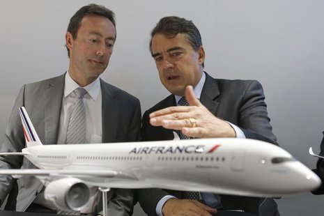 Airbus' Chairman and CEO Fabrice Bregier (L) talks with Air-France KLM Chairman and CEO Alexandre de Juniac during a signing ceremony at the Airbus' Chairman and CEO Fabrice Bregier (L) talks with Air-France KLM Chairman and CEO Alexandre de Juniac during a signing ceremony at the
