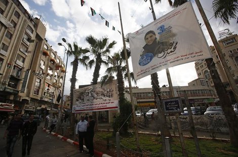 A banner depicting Mohammed Assaf, a contestant in the TV talent show 'Arab Idol', hangs from poles in the West Bank city of Ramallah May 13 A banner depicting Mohammed Assaf, a contestant in the TV talent show 'Arab Idol', hangs from poles in the West Bank city of Ramallah May 13