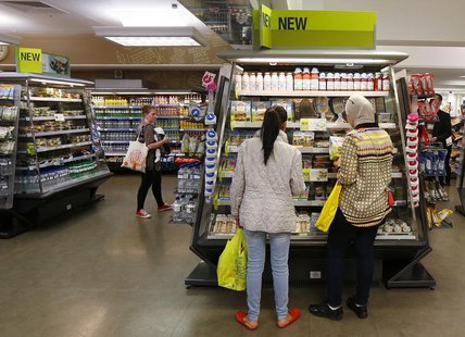 Customers look at a food display in the food hall at a Marks & Spencer shop in central London May 21, 2013. REUTERS/Suzanne Plunkett Customers look at a food display in the food hall at a Marks & Spencer shop in central London May 21, 2013. REUTERS/Suzanne Plunkett