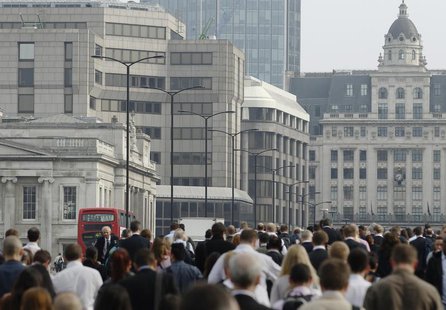 Commuters walk to work across London Bridge, heading into the City of London June 19, 2013. REUTERS/Luke MacGregor Commuters walk to work across London Bridge, heading into the City of London June 19, 2013. REUTERS/Luke MacGregor