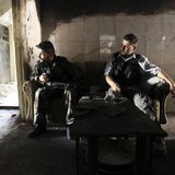 Members of the Free Syrian Army sit on a sofa inside a house in the old city of Aleppo June 19, 2013. REUTERS/Muzaffar Salman Members of the Free Syrian Army sit on a sofa inside a house in the old city of Aleppo June 19, 2013. REUTERS/Muzaffar Salman