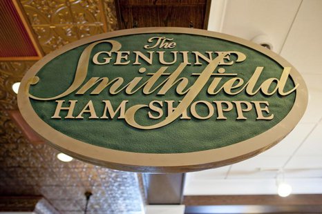 A sign advertising Smithfield hams hangs at the Taste of Smithfield restaurant and gourmet market in Smithfield, Virginia May 30, 2013. REUT A sign advertising Smithfield hams hangs at the Taste of Smithfield restaurant and gourmet market in Smithfield, Virginia May 30, 2013. REUT