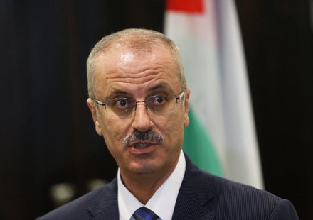 Palestinian Prime Minister Rami Hamdallah speaks during a joint news conference with European Union foreign policy chief Catherine Ashton (n Palestinian Prime Minister Rami Hamdallah speaks during a joint news conference with European Union foreign policy chief Catherine Ashton (n