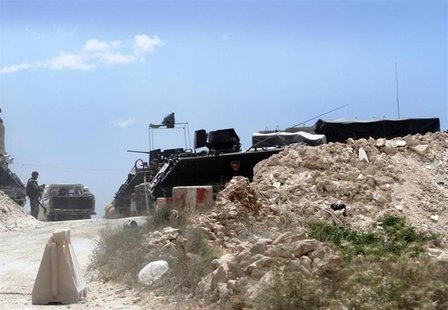 An army soldier mans a checkpoint after two men died in clashes near a Lebanese army checkpoint, in the town of Arsal, in the eastern Bekaa An army soldier mans a checkpoint after two men died in clashes near a Lebanese army checkpoint, in the town of Arsal, in the eastern Bekaa