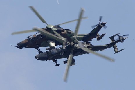 Eurocopter Tiger H61 helicopters take part in a flying display, during the 50th Paris Air Show, at the Le Bourget airport near Paris, June 2 Eurocopter Tiger H61 helicopters take part in a flying display, during the 50th Paris Air Show, at the Le Bourget airport near Paris, June 2
