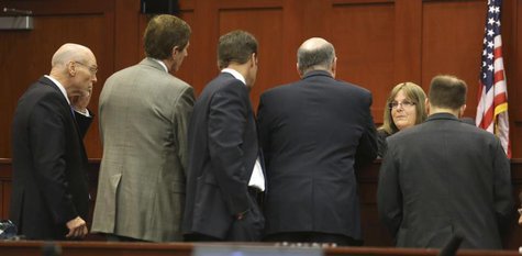 Judge Debra Nelson huddles with the defense and the prosecution teams during the second day of jury selection in the murder trial of George Judge Debra Nelson huddles with the defense and the prosecution teams during the second day of jury selection in the murder trial of George