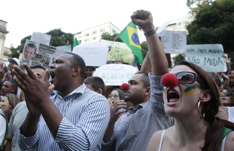 Demonstrators shout anti-government slogans during a protest in Rio de Janeiro, one of many such protests in Brazil's major cities, June 20, Demonstrators shout anti-government slogans during a protest in Rio de Janeiro, one of many such protests in Brazil's major cities, June 20,