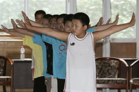 Boys exercise at OK Slim summer camp on the outskirts of Beijing in this August 3, 2006 file photo. REUTERS/Claro Cortes IV Boys exercise at OK Slim summer camp on the outskirts of Beijing in this August 3, 2006 file photo. REUTERS/Claro Cortes IV
