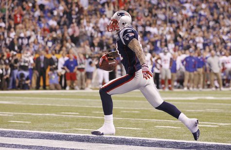 New England Patriots tight end Aaron Hernandez (L) scores a touchdown against the New York Giants during the third quarter in the NFL Super New England Patriots tight end Aaron Hernandez (L) scores a touchdown against the New York Giants during the third quarter in the NFL Super
