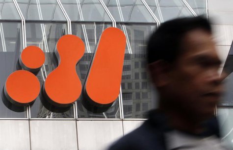 A man walks past the head office of BHP Billiton in central Melbourne October 18, 2010. REUTERS/Mick Tsikas A man walks past the head office of BHP Billiton in central Melbourne October 18, 2010. REUTERS/Mick Tsikas