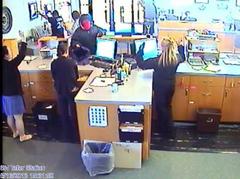 Surveillance video still of United One Credit Union robbery. Surveillance video still of United One Credit Union robbery.