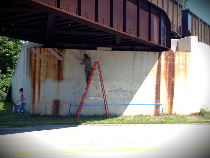Artist Gabriel Specter painting for The Sheboygan Project