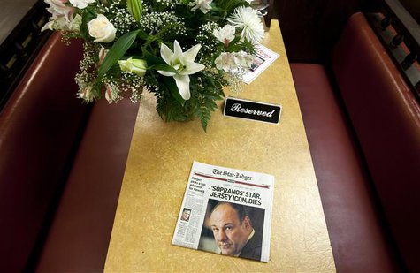 A newspaper and bouquet of flowers adorn a booth in Holsten's Ice Cream Shop, which was the location of the final scene where the TV show "T A newspaper and bouquet of flowers adorn a booth in Holsten's Ice Cream Shop, which was the location of the final scene where the TV show "T