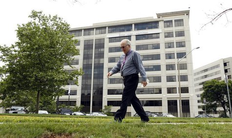 A man walks pass the Booz Allen Hamilton Holding Corp building in McLean, Virginia June 11, 2013. REUTERS/Kevin Lamarque A man walks pass the Booz Allen Hamilton Holding Corp building in McLean, Virginia June 11, 2013. REUTERS/Kevin Lamarque