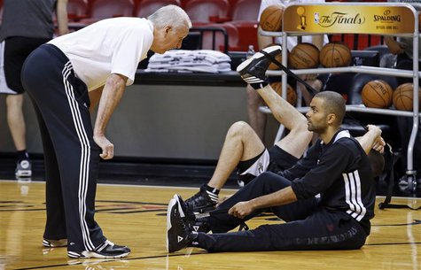 San Antonio Spurs Head Coach Gregg Popovich (L) talks with guard Tony Parker during a team practice ahead of Game 7 of the NBA Finals basket San Antonio Spurs Head Coach Gregg Popovich (L) talks with guard Tony Parker during a team practice ahead of Game 7 of the NBA Finals basket