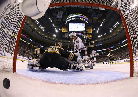 A shot from Chicago Blackhawks defenseman Brent Seabrook gets past Boston Bruins goalie Tuukka Rask (40) in overtime during Game 4 of their A shot from Chicago Blackhawks defenseman Brent Seabrook gets past Boston Bruins goalie Tuukka Rask (40) in overtime during Game 4 of their