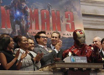 Actor Robert Downey Jr. (C) rings the opening bell at the New York Stock Exchange to promote his new movie 'Iron Man 3' April 30, 2013. REUT Actor Robert Downey Jr. (C) rings the opening bell at the New York Stock Exchange to promote his new movie 'Iron Man 3' April 30, 2013. REUT
