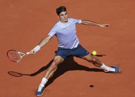 Roger Federer of Switzerland hits a return to Jo-Wilfried Tsonga of France during their men's singles quarter-final match at the French Open Roger Federer of Switzerland hits a return to Jo-Wilfried Tsonga of France during their men's singles quarter-final match at the French Open