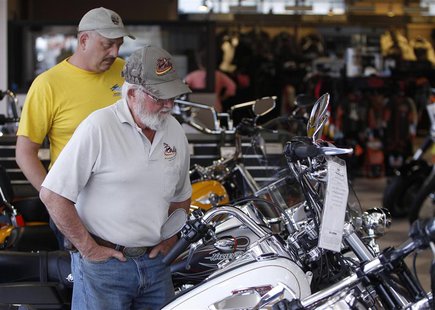Customers look at the showroom inventory at Harley-Davidson of Frederick in Frederick Maryland in this October 23, 2012 file photo. Unless t Customers look at the showroom inventory at Harley-Davidson of Frederick in Frederick Maryland in this October 23, 2012 file photo. Unless t