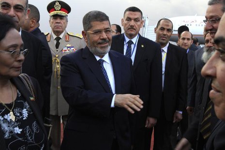 Egypt's President Mohamed Mursi (C) arrives at Bole International airport for the 21st Ordinary Session of the African Union (AU) in Addis A Egypt's President Mohamed Mursi (C) arrives at Bole International airport for the 21st Ordinary Session of the African Union (AU) in Addis A