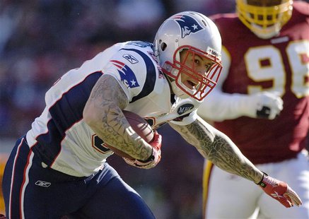 New England Patriots tight end Aaron Hernandez runs after a catch against the Washington Redskins during the first half of their NFL footbal New England Patriots tight end Aaron Hernandez runs after a catch against the Washington Redskins during the first half of their NFL footbal