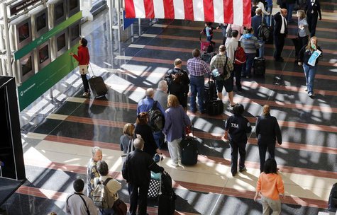 A line of passengers wait to enter the security checkpoint before boarding their aircraft at Reagan National Airport in Washington, April 25 A line of passengers wait to enter the security checkpoint before boarding their aircraft at Reagan National Airport in Washington, April 25