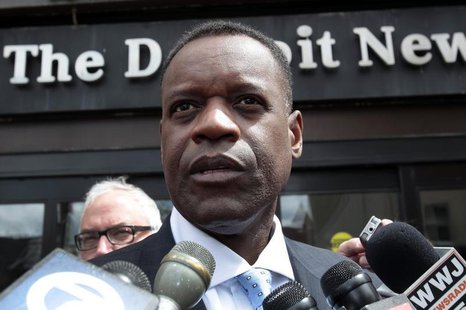 Detroit's emergency financial manager Kevyn Orr talks to members of the media outside the Detroit Newspapers building about the report he de Detroit's emergency financial manager Kevyn Orr talks to members of the media outside the Detroit Newspapers building about the report he de