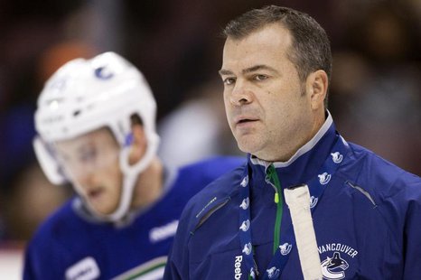 Vancouver Canucks head coach Alain Vigneault looks on during the second day of training camp in Vancouver, British Columbia January 14, 2013 Vancouver Canucks head coach Alain Vigneault looks on during the second day of training camp in Vancouver, British Columbia January 14, 2013