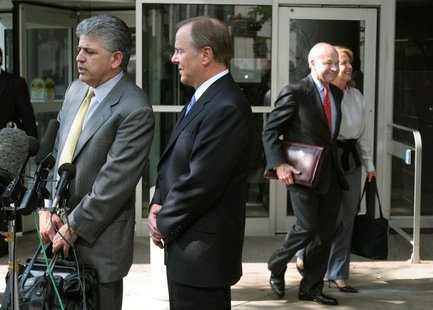 Former Enron Chief Executive Jeffrey Skilling (2L) and attorney Daniel Petrocelli (L) talk to reporters as former Enron Chairman and CEO Ken Former Enron Chief Executive Jeffrey Skilling (2L) and attorney Daniel Petrocelli (L) talk to reporters as former Enron Chairman and CEO Ken