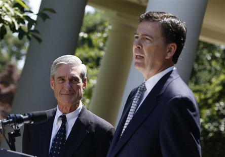 James Comey (R), a Republican who served in the Bush Justice Department, speaks alongside outgoing FBI Director Robert Mueller after being n James Comey (R), a Republican who served in the Bush Justice Department, speaks alongside outgoing FBI Director Robert Mueller after being n