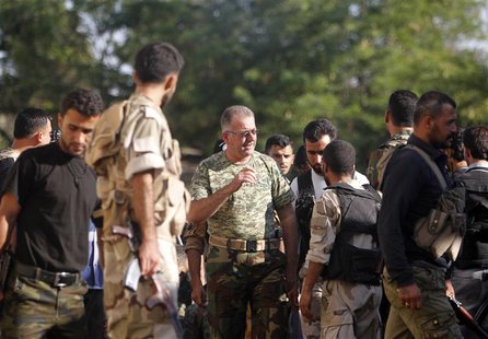 Colonel Abdul-Jabbar al-Aqidi, commander of the rebels’ Military Council in Aleppo, is seen among members of Ghurabaa al-Sham brigade in the Colonel Abdul-Jabbar al-Aqidi, commander of the rebels’ Military Council in Aleppo, is seen among members of Ghurabaa al-Sham brigade in the