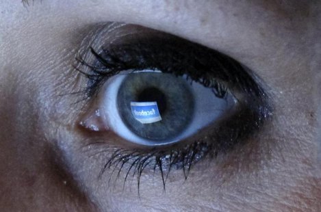 An illustration picture shows a woman looking at the Facebook website on a computer in Munich February 2, 2012. REUTERS/Michael Dalder An illustration picture shows a woman looking at the Facebook website on a computer in Munich February 2, 2012. REUTERS/Michael Dalder