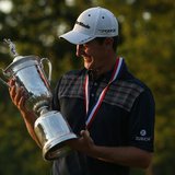 England's Justin Rose looks at the U.S. Open Trophy after winning the 2013 U.S. Open golf championship at the Merion Golf Club in Ardmore, P England's Justin Rose looks at the U.S. Open Trophy after winning the 2013 U.S. Open golf championship at the Merion Golf Club in Ardmore, P