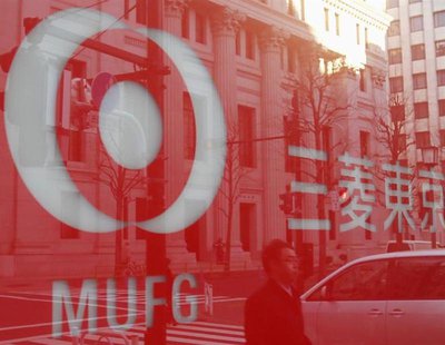 A pedestrian is reflected on a logo of Bank of Tokyo-Mitsubishi UFJ in Tokyo December 13, 2012. REUTERS/Yuriko Nakao A pedestrian is reflected on a logo of Bank of Tokyo-Mitsubishi UFJ in Tokyo December 13, 2012. REUTERS/Yuriko Nakao