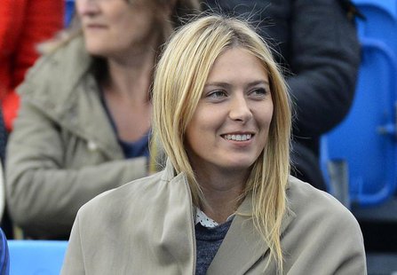 Russia's Maria Sharapova watches Bulgaria's Grigor Dimitrov play Israel's Dudi Sela in their men's singles tennis match at the Queen's Club Russia's Maria Sharapova watches Bulgaria's Grigor Dimitrov play Israel's Dudi Sela in their men's singles tennis match at the Queen's Club