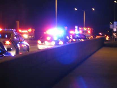 Emergency vehicles and other vehicles block the Maple Ridge Road bridge 6/22/13 as an injured man is loaded into an ambulance. Emergency vehicles and other vehicles block the Maple Ridge Road bridge 6/22/13 as an injured man is loaded into an ambulance.