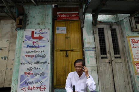 A man talks on his mobile phone by the street side of Yangon June 21, 2013. REUTERS/Soe Zeya Tun A man talks on his mobile phone by the street side of Yangon June 21, 2013. REUTERS/Soe Zeya Tun