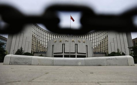 The headquarters of China's central bank, the People's Bank of China, is pictured behind an iron chain in Beijing, June 21, 2013. REUTERS/Ja The headquarters of China's central bank, the People's Bank of China, is pictured behind an iron chain in Beijing, June 21, 2013. REUTERS/Ja
